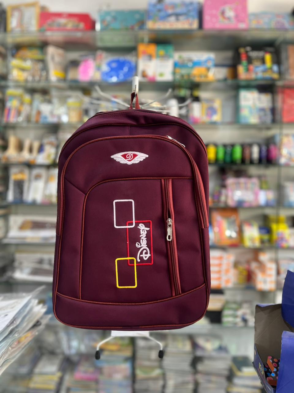 Minimalist Sleek Grey School Backpack with Vibrant Pom-Pom Charm