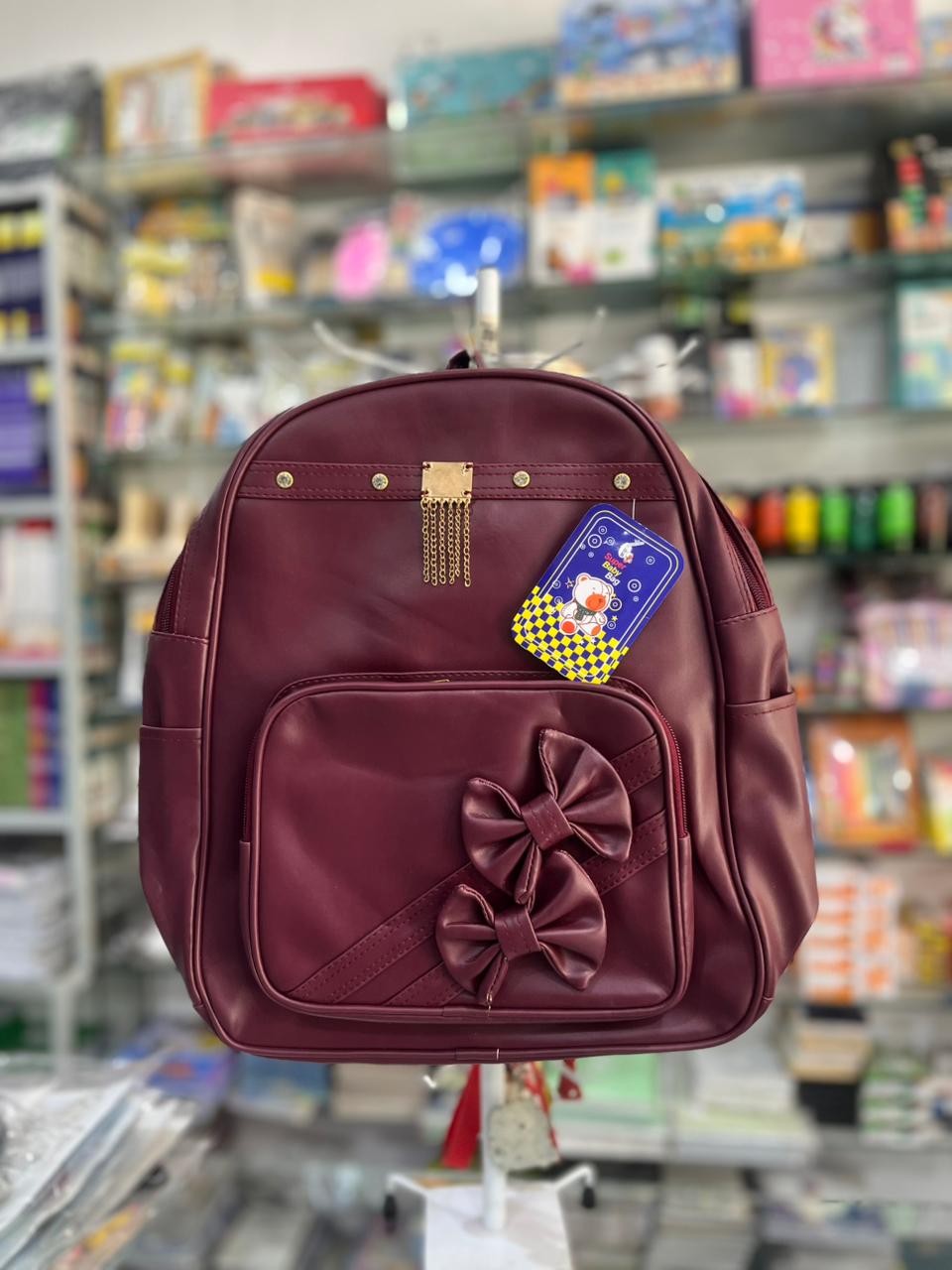 Elegant Maroon Faux Leather Backpack with Twin Bows & Gold Chain Accent